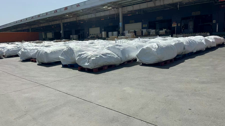 Packed cargo pallets ready for shipment at a logistics site