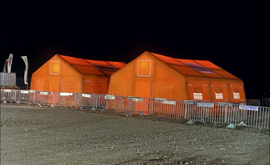 Illuminated tents during a nighttime field deployment